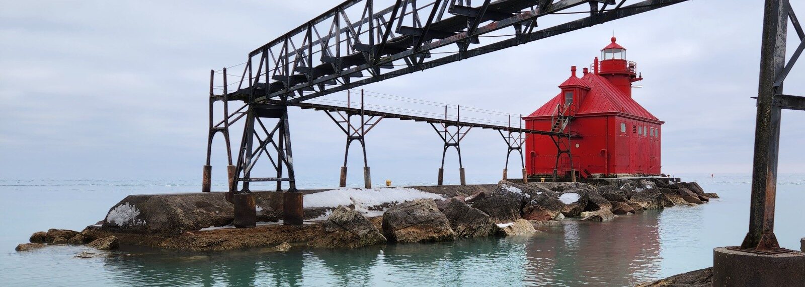 A lighthouse in Sturgeon Bay stands proudly over the chilled water of Lake Michigan.