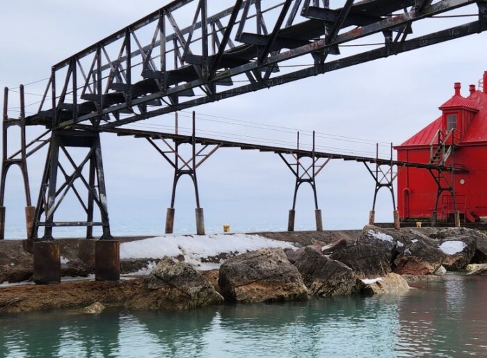 A lighthouse in Sturgeon Bay stands proudly over the chilled water of Lake Michigan.