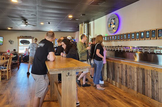 Owned by former Chicago residents, Thirsty Cow Taphouse in Baileys Harbor is the only self-pour taphouse in Door County, and it’s one of the most fun places to visit for a Packers game! Game-day specials include 10% off the tap wall, a raffle drawing for a free pour after each Packers score, and a free T-shirt to the fan with the most team spirit! Their 25 taps are also on a constant rotation, but only featuring Wisconsin-made local and craft beer. There are even six taps of cocktails, including the Moogarita, Cow Punch, Brandy Old Fashioned Sweet, and so much more! Their shareable appetizers are the best pre-game to the meal, with their iconic Tipsy Tots smothered in cheese, house pulled pork, BBQ sauce, and bacon; Rooster Wings with six house wing sauces; and a giant Brewhaus Pretzel that nearly weighs a pound! Burgers are Thirsty Cow’s specialty, with thick patties coming topped with cheese curds and ranch dressing, or bacon and tater tots, or even an over-easy egg, peanut butter, and lingonberry! Enough about the food now—what about the football? Even if the Packers is the team of choice, the environment is fun for everyone, with friendly service from servers and an easy-going atmosphere from patrons. Watch the game inside at a table or outside on the patio, with string lights and cushioned chairs for your comfort. During halftime, play a game of giant Connect 4, cornhole, or some board games, and remember to refill your glass!